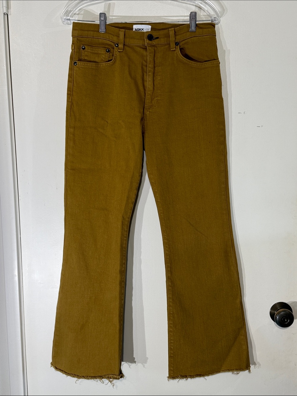 ASKKNY High-Rise Flared Jeans in Mustard